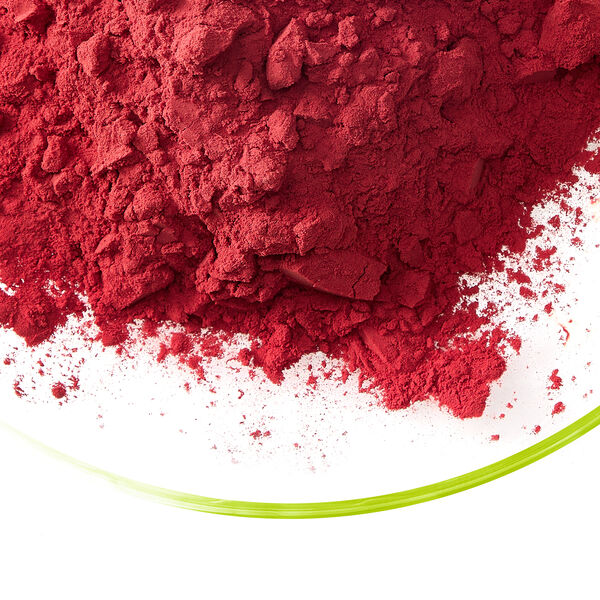 Vepro i-red bright red protein powder in a glass dish